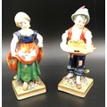 A pair of Sitzendorf figurines, boy 14.5cms h, girl with ducks 14cms h.