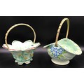 Two Burslem floral painted ceramic baskets with wicker handles. Tallest 27cms h.
