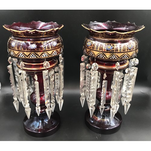 107 - A pair of gilt and floral painted ruby glass lustres with clear glass droplets. 39cms h.