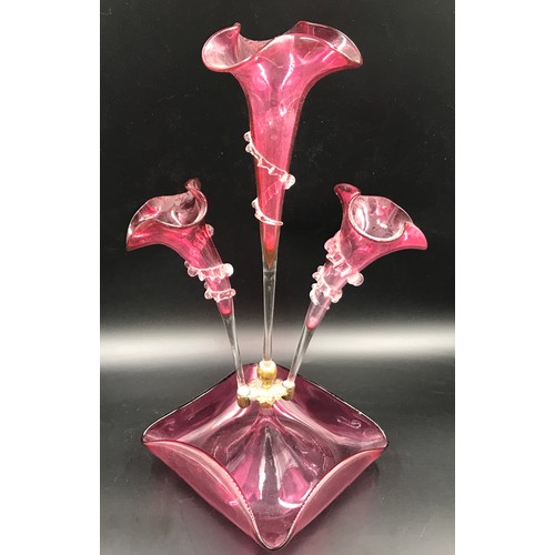 109 - A ruby glass epergne with 3 flutes. 44cms h x 26cms w at base.