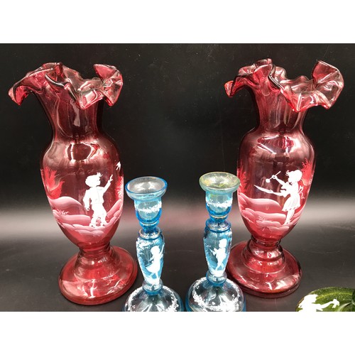 110 - A selection of Mary  Gregory glass ware  comprising: a pair of ruby vases with flared rims 28.5cms h... 