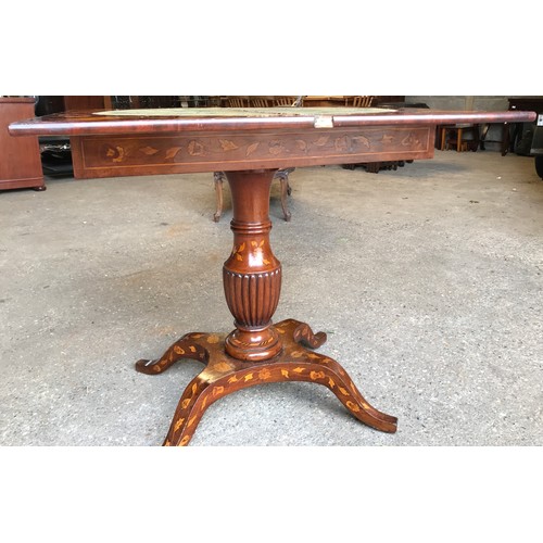 741 - A fine quality Victorian walnut inlaid fold over card table with reeded single pedestal base on four... 