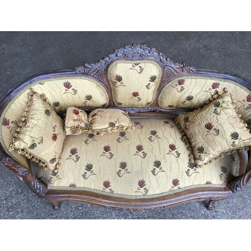 744 - A 19thC carved walnut framed two seater sofa, floral upholstered with matching cushions. Height to s... 