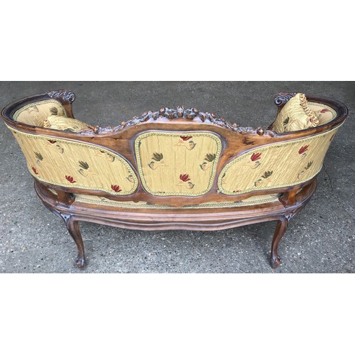 744 - A 19thC carved walnut framed two seater sofa, floral upholstered with matching cushions. Height to s... 