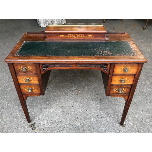 745 - An Edwardian rose wood inlaid desk with green leather top , 6 drawers and square legs. 92cms w x 49c... 