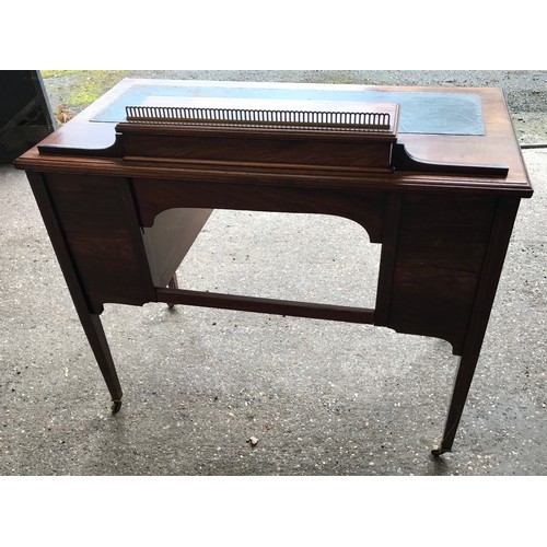 745 - An Edwardian rose wood inlaid desk with green leather top , 6 drawers and square legs. 92cms w x 49c... 