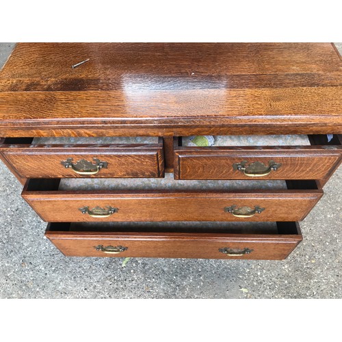 747 - An oak 2 over 2 dressing table with brass handles and square legs. 84cms w x 46cms d x 70cms height ... 