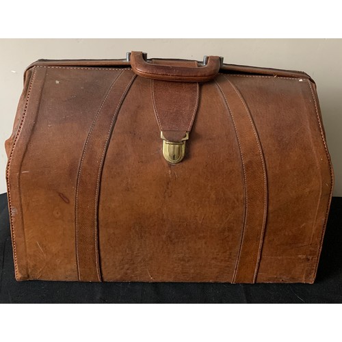 614 - A vintage leather suitcase 47cms w x 37cms l.