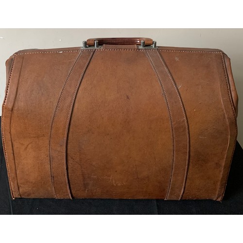 614 - A vintage leather suitcase 47cms w x 37cms l.