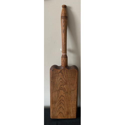 616 - An oak wash bat. 73cms l .