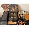 A miscellany comprising fans, oriental laquer boxes, part chess set, photograph frame etc.