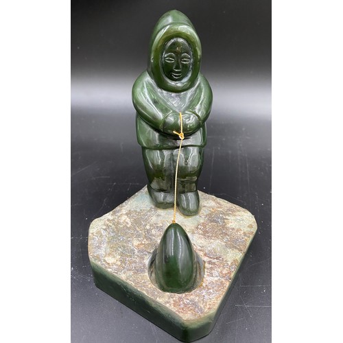 629 - A green stone Eskimo with a seal 13.5cms h together with an Indian pietra dura plaque.