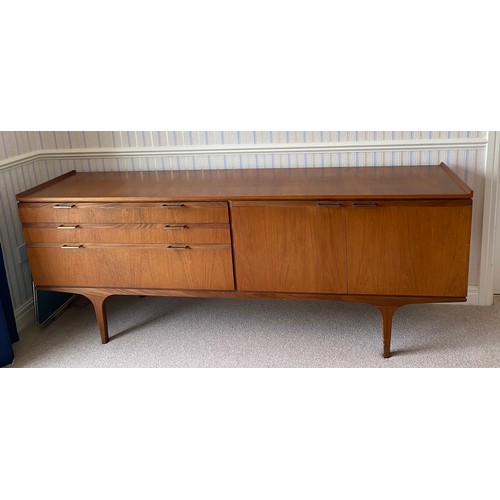 731 - A Merridew teak sideboard with 2 doors, 3 drawers. 199cms l x 45cms d x 76cms h.