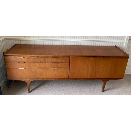 731 - A Merridew teak sideboard with 2 doors, 3 drawers. 199cms l x 45cms d x 76cms h.