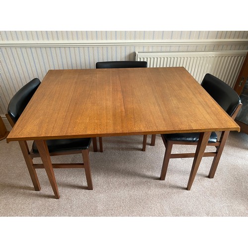 732 - A Merridew extending teak dining table and 6 Merridew chairs. Extended 19cms x 89cms. Closed 118cms.... 