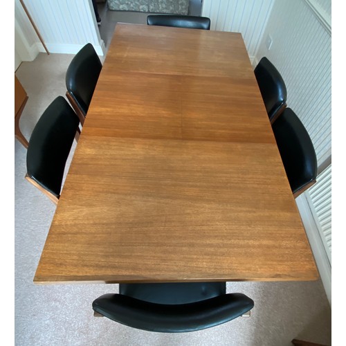 732 - A Merridew extending teak dining table and 6 Merridew chairs. Extended 19cms x 89cms. Closed 118cms.... 