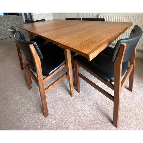 732 - A Merridew extending teak dining table and 6 Merridew chairs. Extended 19cms x 89cms. Closed 118cms.... 