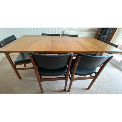 732 - A Merridew extending teak dining table and 6 Merridew chairs. Extended 19cms x 89cms. Closed 118cms.... 