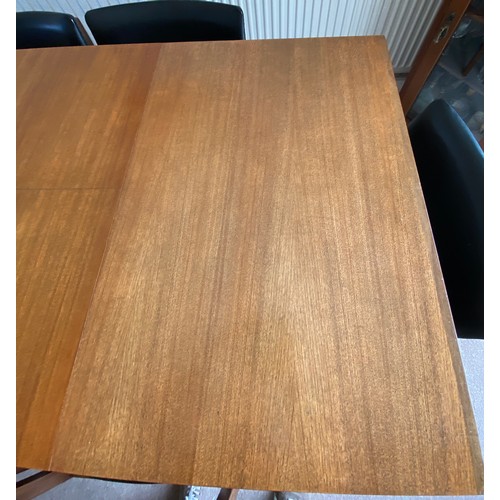 732 - A Merridew extending teak dining table and 6 Merridew chairs. Extended 19cms x 89cms. Closed 118cms.... 