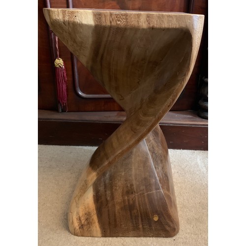 733 - A carved wooden table 51cms h.