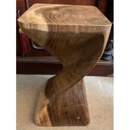 733 - A carved wooden table 51cms h.