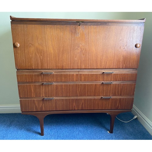 735 - A Merridew teak desk with 2 short over 2 long drawers. 111cms h x 119.5cms w x 45cms d.