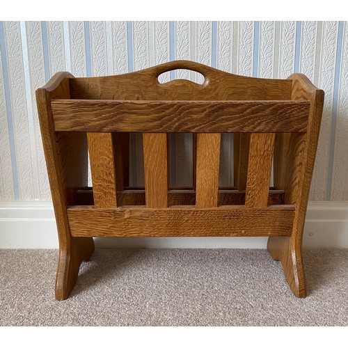 736 - Alan 'Acornman' Grainger of Brandsby, oak magazine rack with slatted tapering sides bearing a fixed ... 