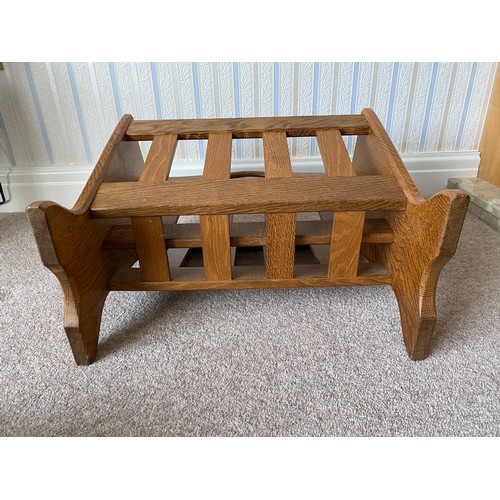 736 - Alan 'Acornman' Grainger of Brandsby, oak magazine rack with slatted tapering sides bearing a fixed ... 