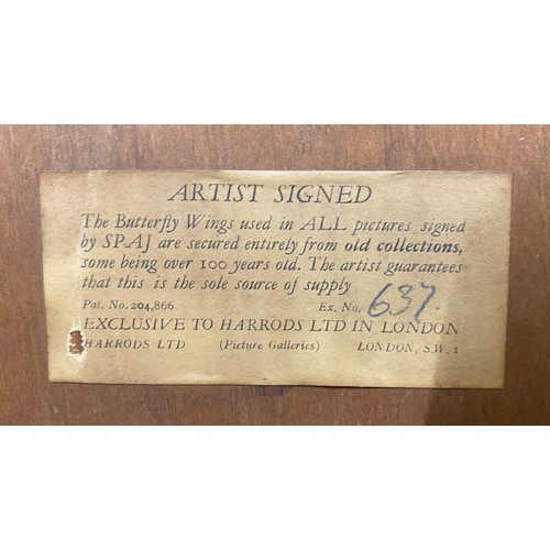 677 - A framed print from Harrods of a stained glass Church window with butterfly wing decoration. Signed ... 