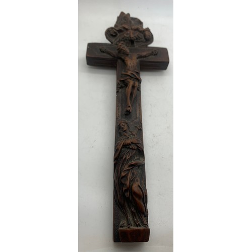 633 - A well carved crucifix with sliding compartment to rear, 24cms l.