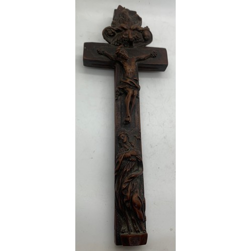 633 - A well carved crucifix with sliding compartment to rear, 24cms l.