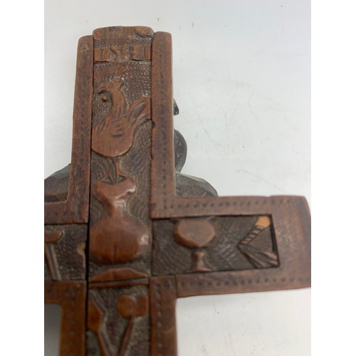 633 - A well carved crucifix with sliding compartment to rear, 24cms l.