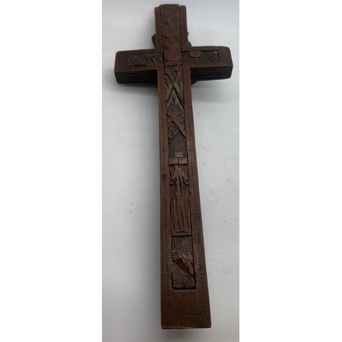 633 - A well carved crucifix with sliding compartment to rear, 24cms l.