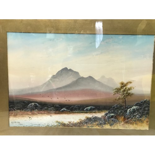 705 - A pair of gilt framed water colours by R J Pollard 1915 of mountain lake scenes.
Pictures 32.5cms x ... 