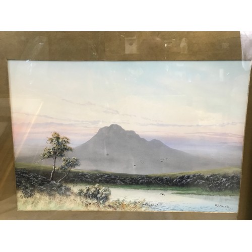 705 - A pair of gilt framed water colours by R J Pollard 1915 of mountain lake scenes.
Pictures 32.5cms x ... 