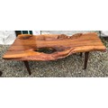 A natural pine coffee table on teak legs. 125cms w x 59cms d x 41cms h.