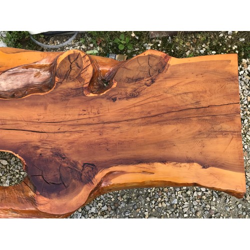725 - A natural pine coffee table on teak legs. 125cms w x 59cms d x 41cms h.