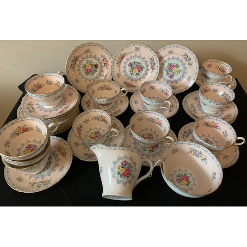 82 - A Shelley tea service comprising 10 cups, 11 saucers, 12 plates, milk and sugar.