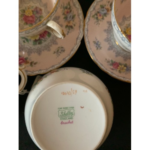 82 - A Shelley tea service comprising 10 cups, 11 saucers, 12 plates, milk and sugar.