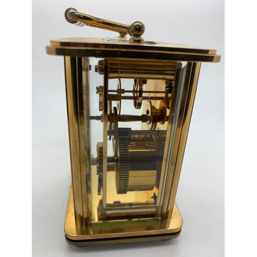 Lot - A SWISS POLISHED BRASS CARRIAGE CLOCK WITH ALARM, MOVEMENT BY MATTHEW  NORMAN, NUMBERED 1754, ELEVEN JEWELS, 20TH CENTURY