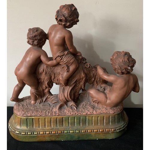 719 - A plaster group of cherubs and a goat, signed Cipriani?