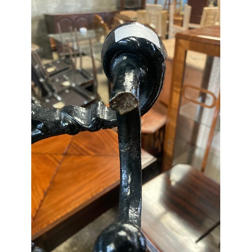 651 - A 19thC cast iron stick stand. 156 h x 50cms w,