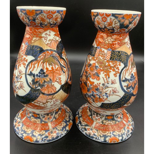 77 - A pair of 19thC Imari vases 31.5cms h.