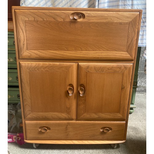 810 - An Ercol drinks cabinet, over 2 cupboard and long drawer. 82 w x 43 d x 110cms h.