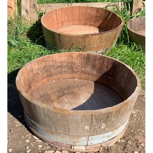 820 - Two wooden coopered planters. 66 d x 24cms h.