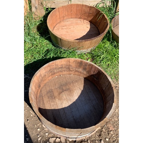 820 - Two wooden coopered planters. 66 d x 24cms h.