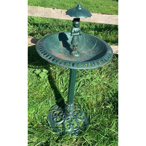 824 - A vintage green cast iron bird bath with figure to top. 47 d x 95cms h.