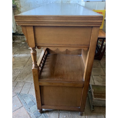 794 - An early 20thC oak Arts and Crafts sideboard. Three cupboards and three drawers with brass handles a... 