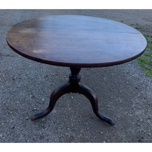 797 - A 19thC mahogany tip top table on tripod base. 98 d x 73cms.