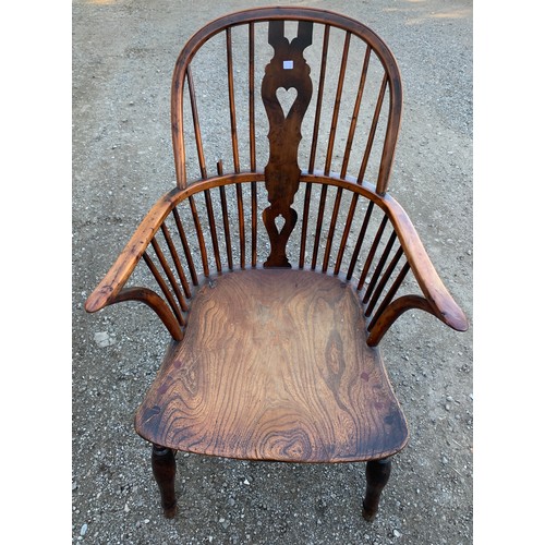 784 - A 19thC elm, ash and yew wood Windsor chair with crinoline stretcher.